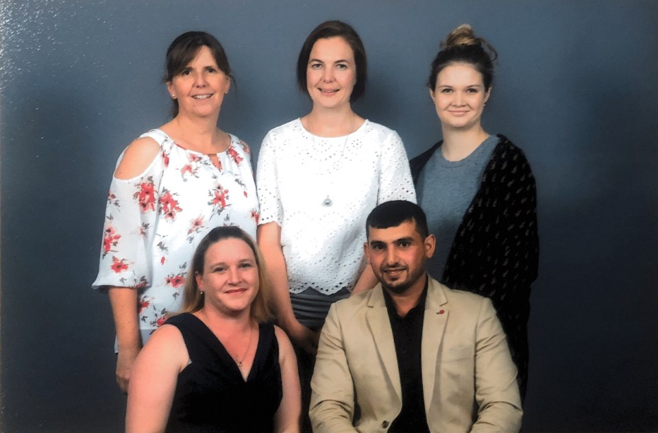 The five-member Ask the Cows project team pictured together at the 2017 Community Leadership Program graduation.