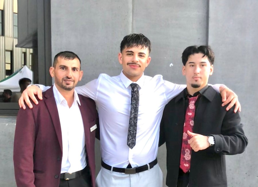 A close group portrait of three people in formal clothing. GSSC Class of 2025.