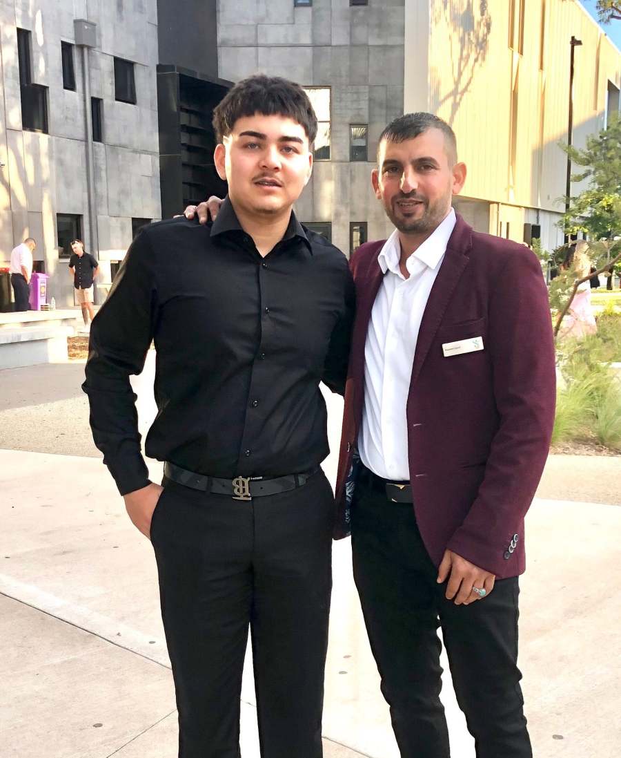 Two people standing together on the campus walkway in formal clothing. GSSC Class of 2025.