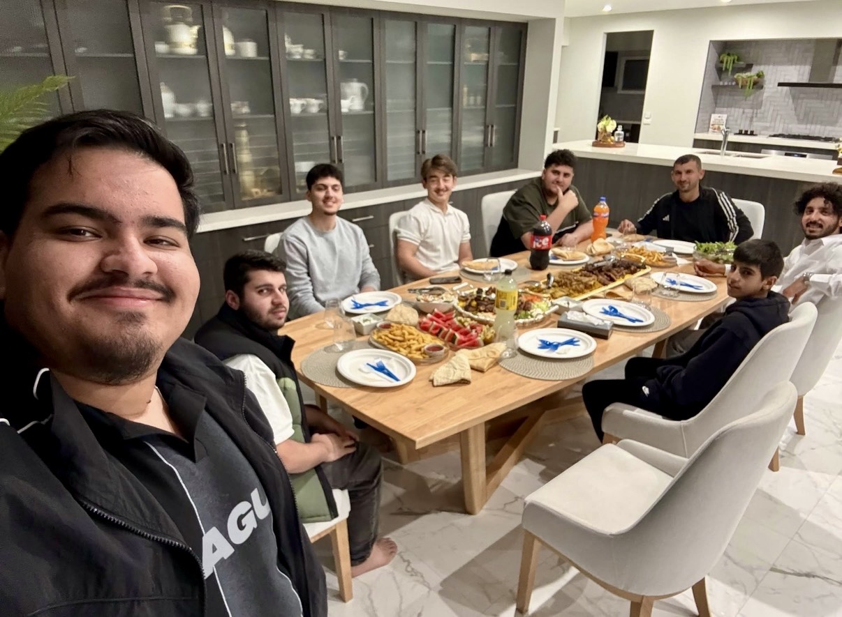 Sharing a meal during Hammood’s visit to Hussam Saraf’s home.