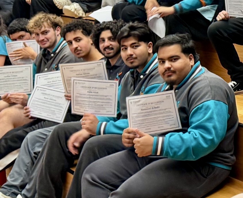Hammood with fellow students holding their 2026 Outstanding Multicultural Leadership & Community Service certificates.