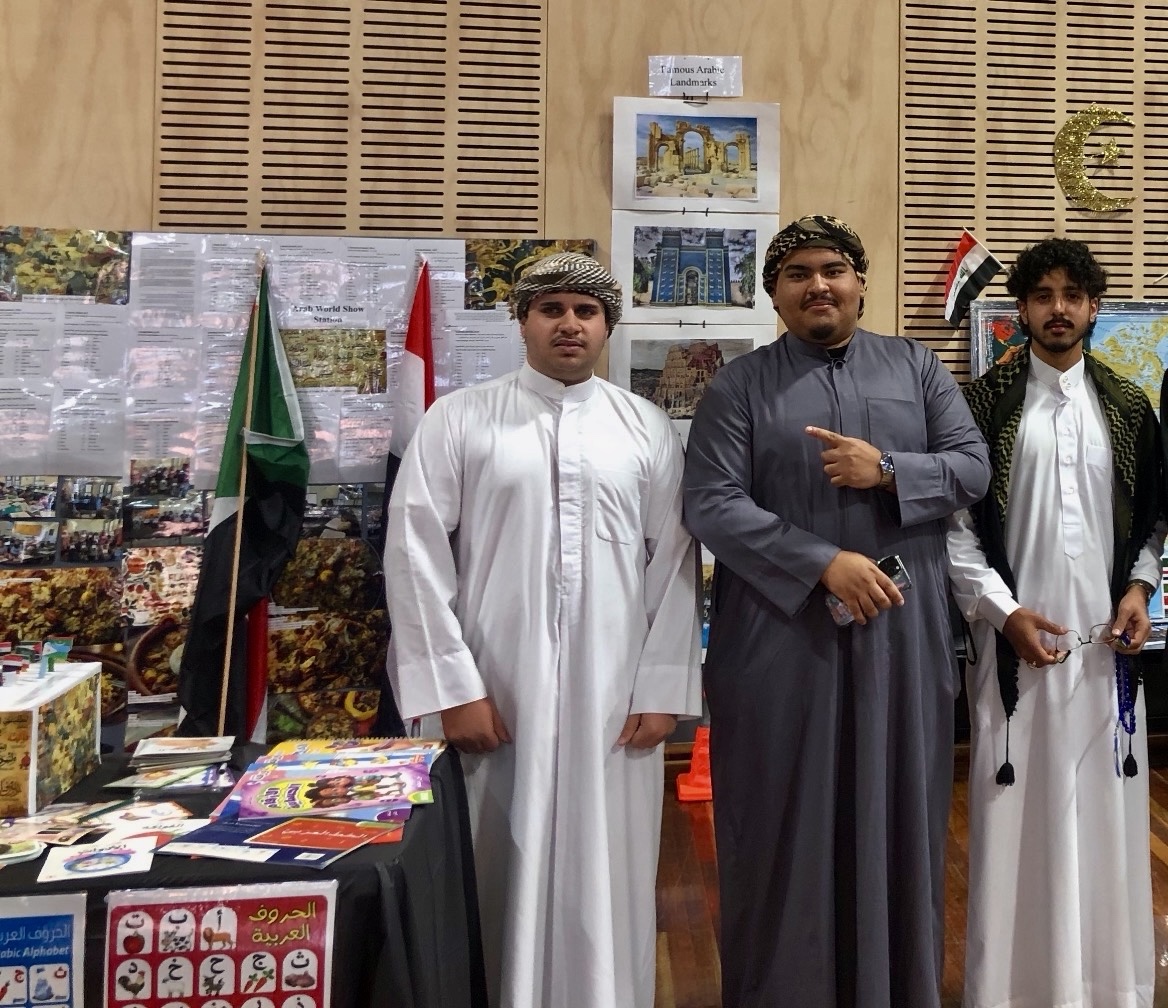 Hammood with fellow participants at the Arabic station during the 2025 Victorian School of Languages Shepparton Culture and Language Expo.