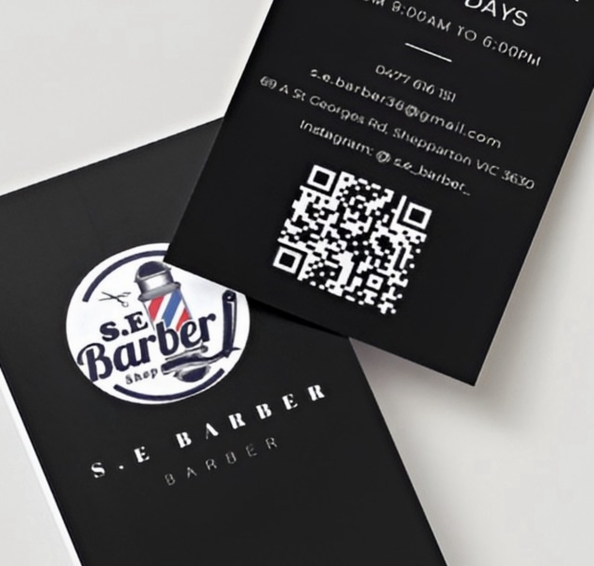 Angled close-up of the S.E Barber business card design by Hammood AL-Badry, showing the logo and QR code.