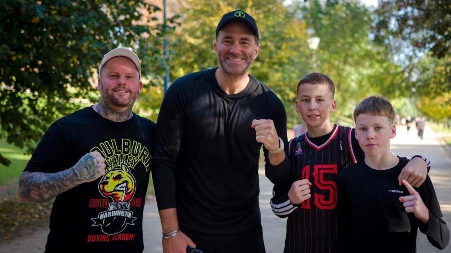 Zedda, Izaiah and Urijah Harrington posing with boxing promoter Eddie Hearn.