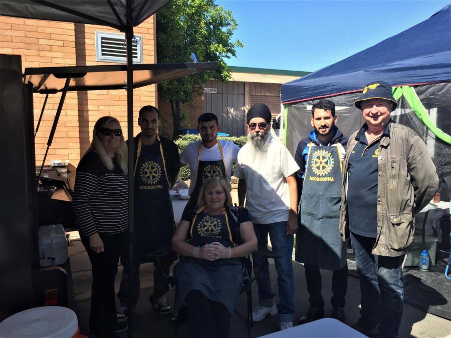 A group of volunteers and visitors beside the Rotary food stall during the October 2017 festival activities.