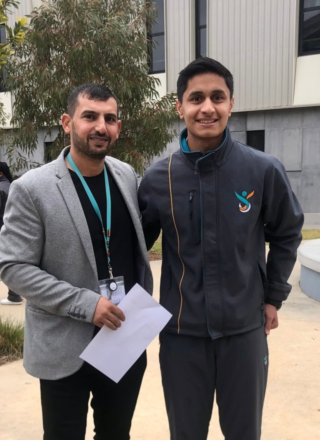 Hussam Saraf and Safa Zahir standing together outside at Greater Shepparton Secondary College.