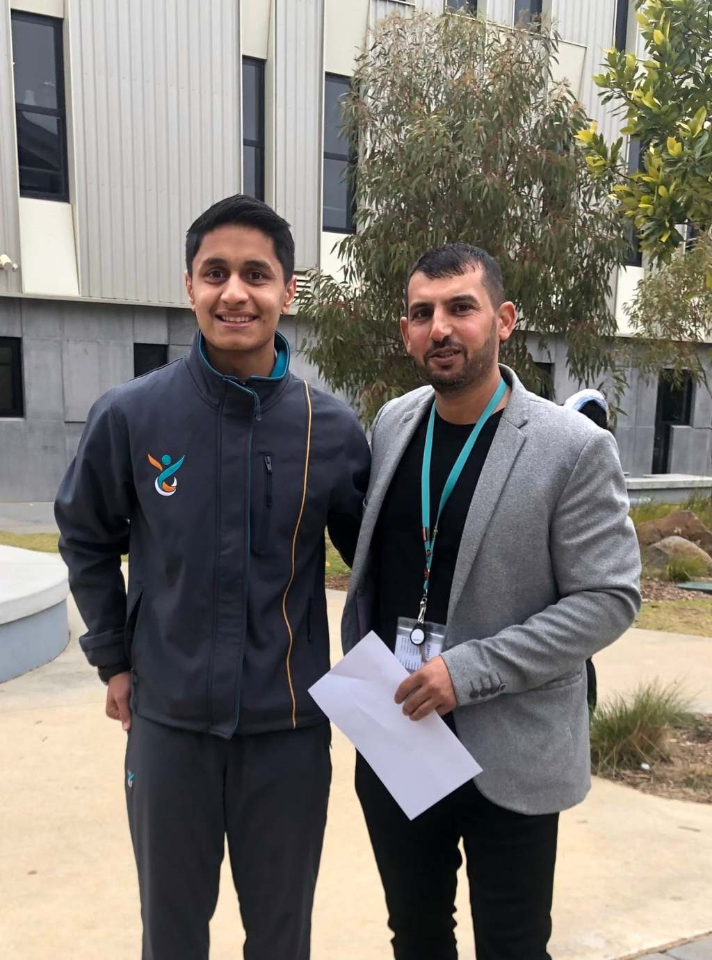 Hussam Saraf and Safa Zahir standing together outside at Greater Shepparton Secondary College.