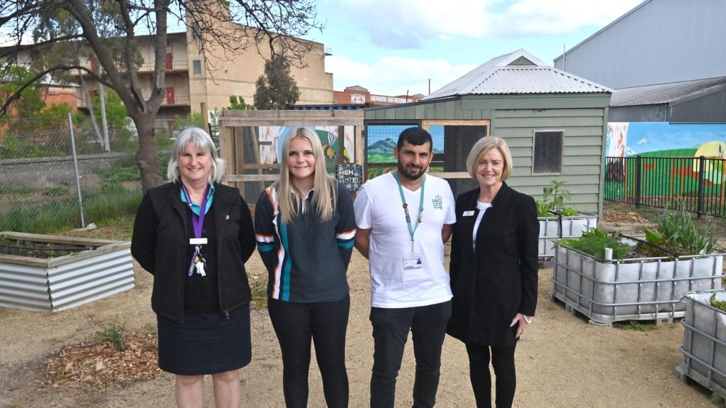 Hussam Saraf with staff and a student at the opening of The Patch school garden.