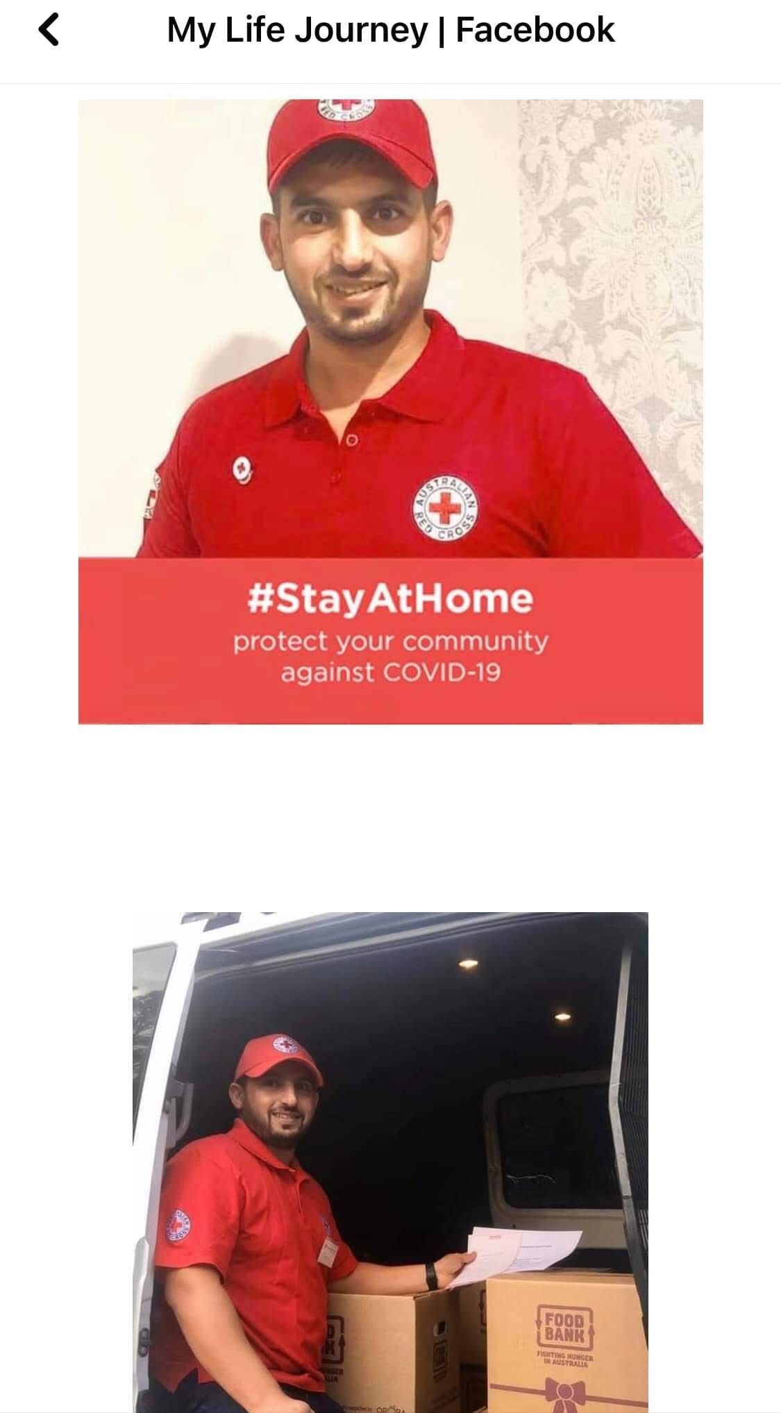 Hussam Saraf in Red Cross clothing beside a van containing food boxes.