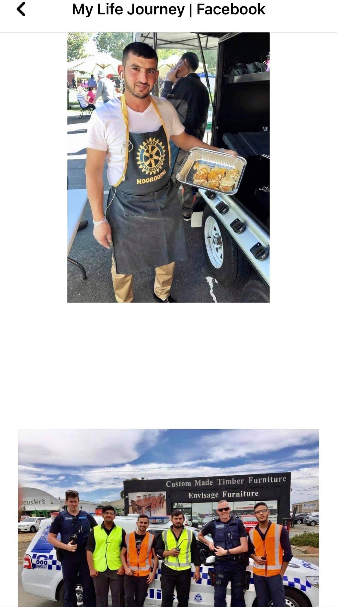 Hussam Saraf holding a tray of food at a Rotary Mooroopna catering trailer.