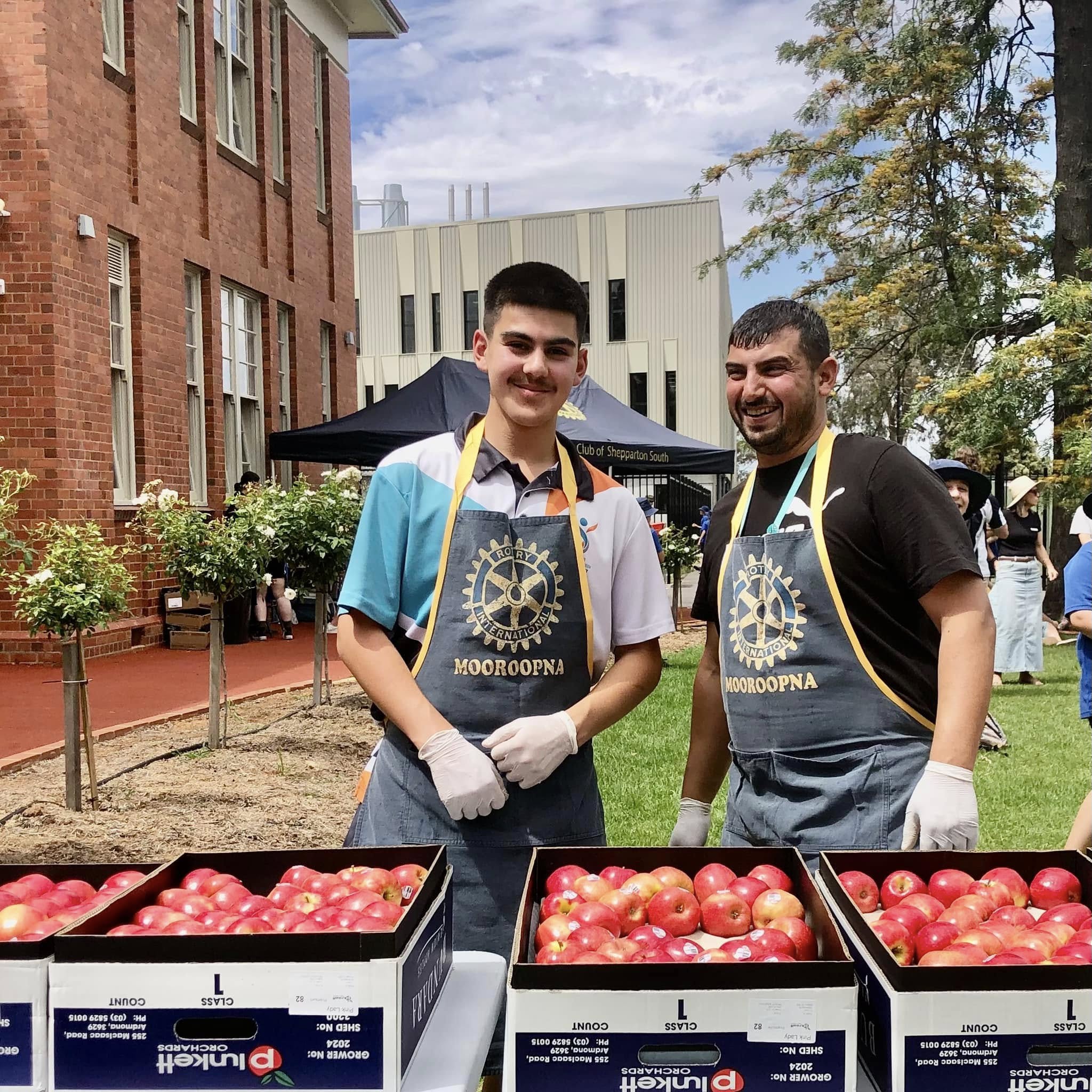 Kadir SUT and Hussam Saraf wearing Rotary volunteer aprons at GSSC Year 5 Aspirations Day.
