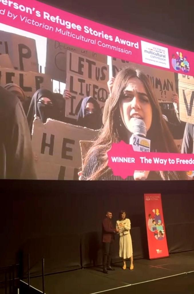 The Way to Freedom winner announcement projected above the award presentation.
