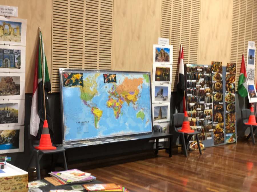 World map and a cultural photograph board at the Arabic station.