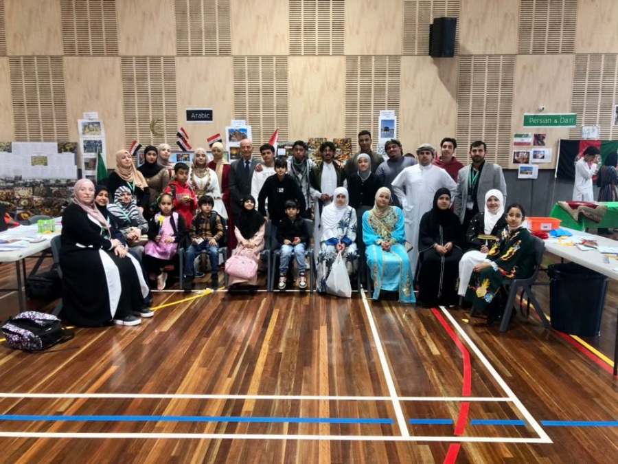 Students and educators gathered for a group photograph among the Expo displays.