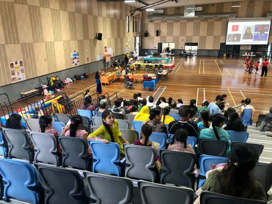 A view over the seating and cultural stations inside the GSSC gymnasium.